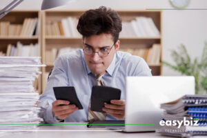 Payroll professional reviewing calculations to resolve payroll reporting and EMP501 reconciliation issues